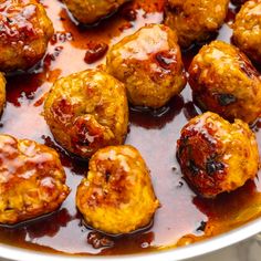 meatballs with sauce in a pan on the stovetop, ready to be eaten