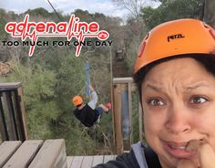 a woman in an orange helmet on a zip line