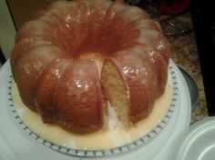 a bundt cake is sitting on a blue and white plate