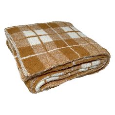 a brown and white checkered blanket is folded up