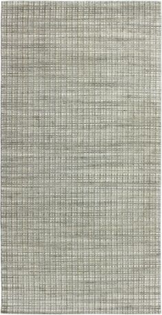 an area rug with grey and white stripes