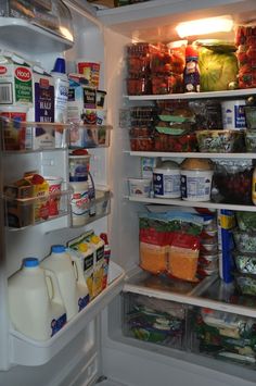 an open refrigerator filled with lots of food