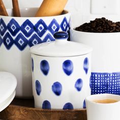 blue and white dishes with coffee beans in them