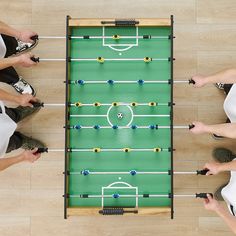 Our green football field surface and the color-coordinated blue and yellow players realistically recreate the atmosphere of a football match. The rounded table corners, ergonomically designed handles, and scoring device add safety and functionality to our foosball table. Rounded Table, Arcade Table, Table Soccer, Football Table, Foosball Table, Soccer Table, Foosball, Game For Kids, Soccer Games