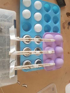 two trays with toothbrushes and some eggs in them