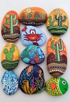 painted rocks with sea creatures and cactuses on them