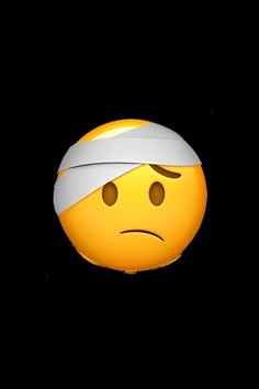 an emoticive smiley face with a bandage around its head