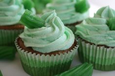 cupcakes with green frosting on white plate