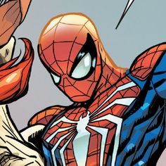 the spider - man is in action with his arm outstretched and head tilted to the side