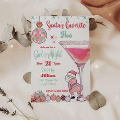 a pink cocktail with santa's favorite slush on it is next to some flowers