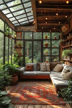 a living room filled with lots of plants and furniture