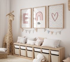 a child's room decorated in pink, white and beige with llamas on the wall