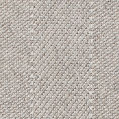 closeup view of the texture of a carpet with white and gray colors on it