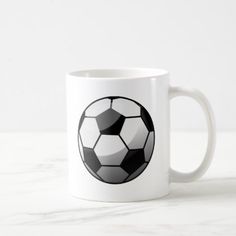 a black and white soccer ball coffee mug