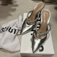 Purchased From Anthropology In May 2024. Silver Leather With Rhinestone Knotted Strap. Super Comfortable And Chic. Worn Once For Family Photos. Size 6b - Runs Tts. Includes Box And Dust Bag. Luxury Silver Pointed Toe Mules, Chic Silver Clutch With Silver-tone Hardware, Elegant Silver Slip-on Mules, Designer Silver Clutch With Silver-tone Hardware, Metallic Silver Pointed Toe Heels With 4-inch Heel, Anthropology, May 2024, Mule, Family Photos