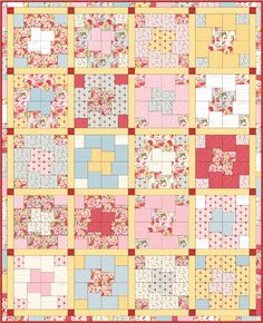 a quilt made with squares and flowers