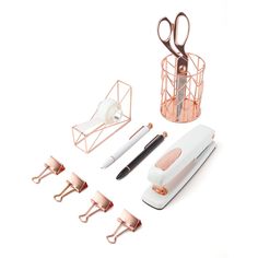 an assortment of office supplies including pens, scissors and paper clips on a white background