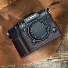 a camera sitting on top of a wooden table