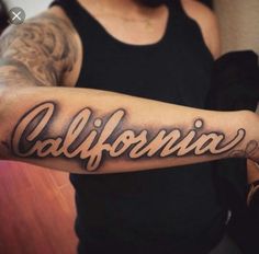 a man's arm with the word california on it and his name in cursive font