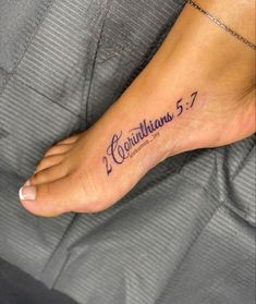 a woman's foot with the word corintians written in cursive font