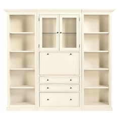 an empty white bookcase with drawers and shelves