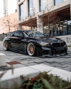 a black car parked in front of a building