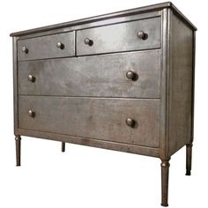 an old dresser with metal knobs on the top and bottom drawers, against a white background