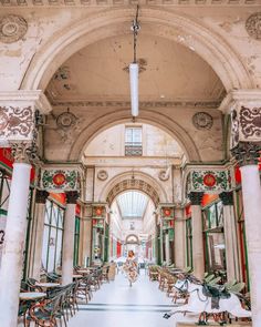 the inside of an old building with tables and chairs