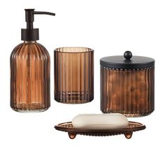 bathroom accessories including soap dispenser, soap dish and toothbrush holder