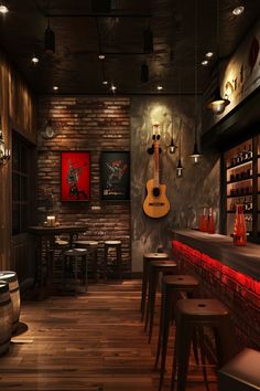 a dimly lit bar with stools and guitars hanging from the wall, along with wooden flooring