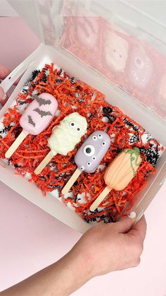 a box filled with halloween treats on top of a table