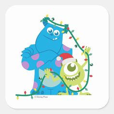 a blue monster and a green monster with christmas lights on their head, standing next to each other