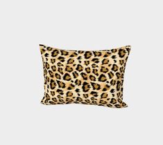 a leopard print pillow on a white background