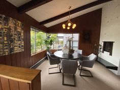 the dining room table is surrounded by chairs