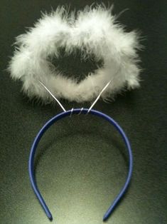 a headband with white fur and blue wire