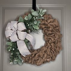 a wreath is hanging on the front door