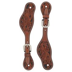 two brown leather suspends with silver buckles on each side and an intricate design