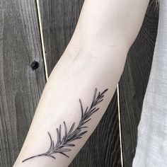 a tattoo on the arm of a person with a flower in it's center