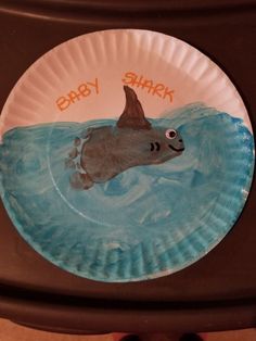 a paper plate with a shark on it