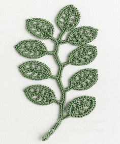 a crocheted green leaf with leaves on it