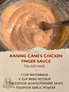 a recipe for dipping sauce in a glass bowl with a spoon on the side that says, raising cane's chicken finger sauce you will need