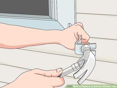 a person opening a window with a pair of scissors in their hand and another hand holding the handle