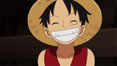 a person wearing a straw hat with a smile on their face and one eye open