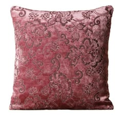 a red velvet pillow with an intricate design on the front and back, sitting on a white background