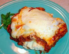 a piece of lasagna on a blue plate