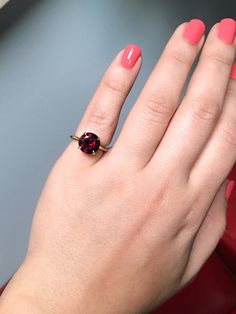 Classic Prong Set Large Garnet Solitaire Proposal/ Engagement Ring. Material: 14K Yellow Gold Finish: High Polished/ Shiny Fit: Standard with Rounded Exterior Weight: apx 4.2gr. Width: 2mm Height: 2mm Stone: Natural Garnet Quality: AAA Center Stone: 10mm Carat Weight: apx. 4.2ct. Shape & Cut: Round, Diamond Cut Height Above Finger: 7mm Setting: Prong Set 4 Eagle Claw Prongs Many choose a solitaire setting for its classic elegance and its ability to showcase the beauty of the single stone. Th January Birthstone Rings, Garnet Engagement Ring, Single Stone Ring, Solitaire Setting, Claw Prong, January Birthstone, Single Stone, Proposal Ring, Garnet Rings