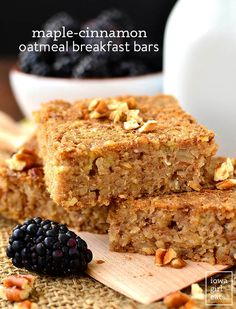 two pieces of granola oatmeal breakfast bars on a cutting board