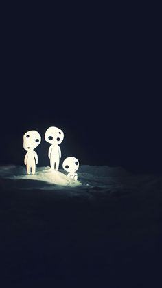 three little people standing in the dark with one light shining on their face and another looking at them