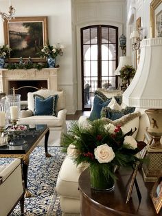 a living room filled with furniture and a fire place in the middle of a room