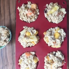 muffins with fruit and other toppings on a red tray